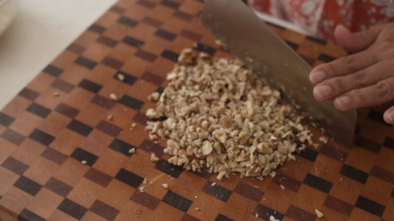 Walnuts are finely chopped with a knife