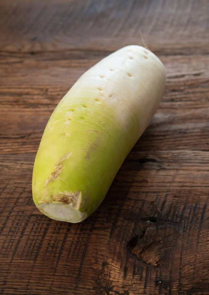 Korean radish is rounder and has a green hues toward the stem