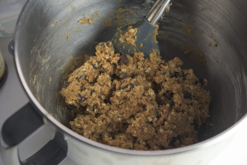 Chocolate wheat germ cookie dough is made on a mixing bowl.