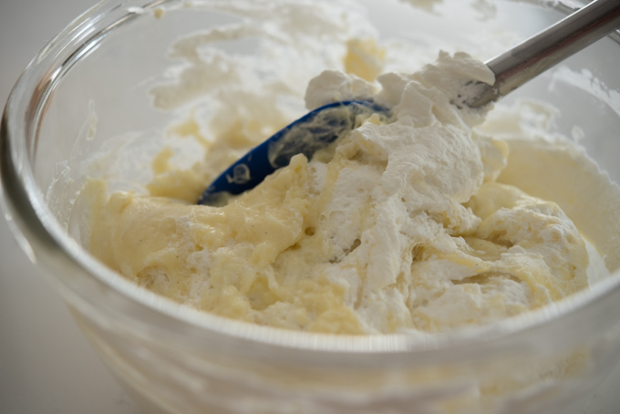 Whipped cream is folded to pastry cream mixture.