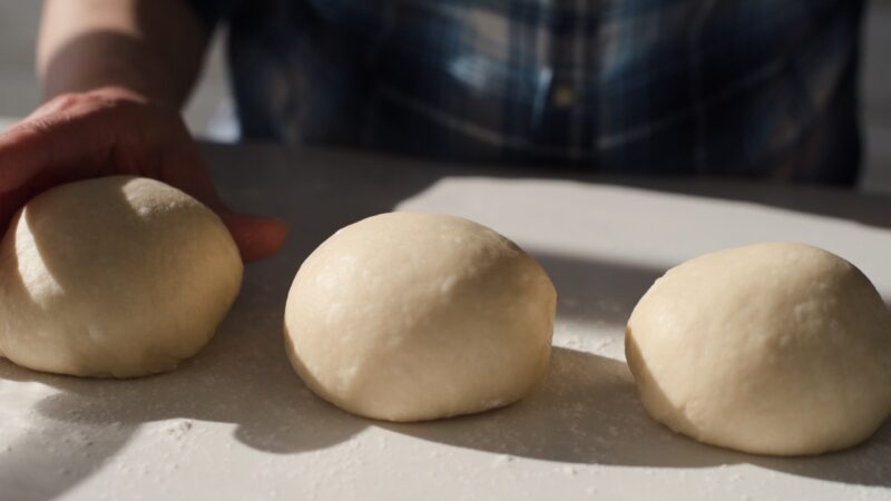 A milk bread dough divided into 3 portions.