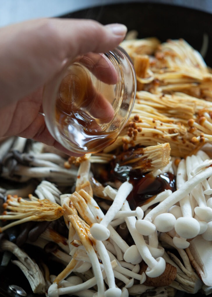 Soy sauce mixture is added to various mushroom stir-fry.