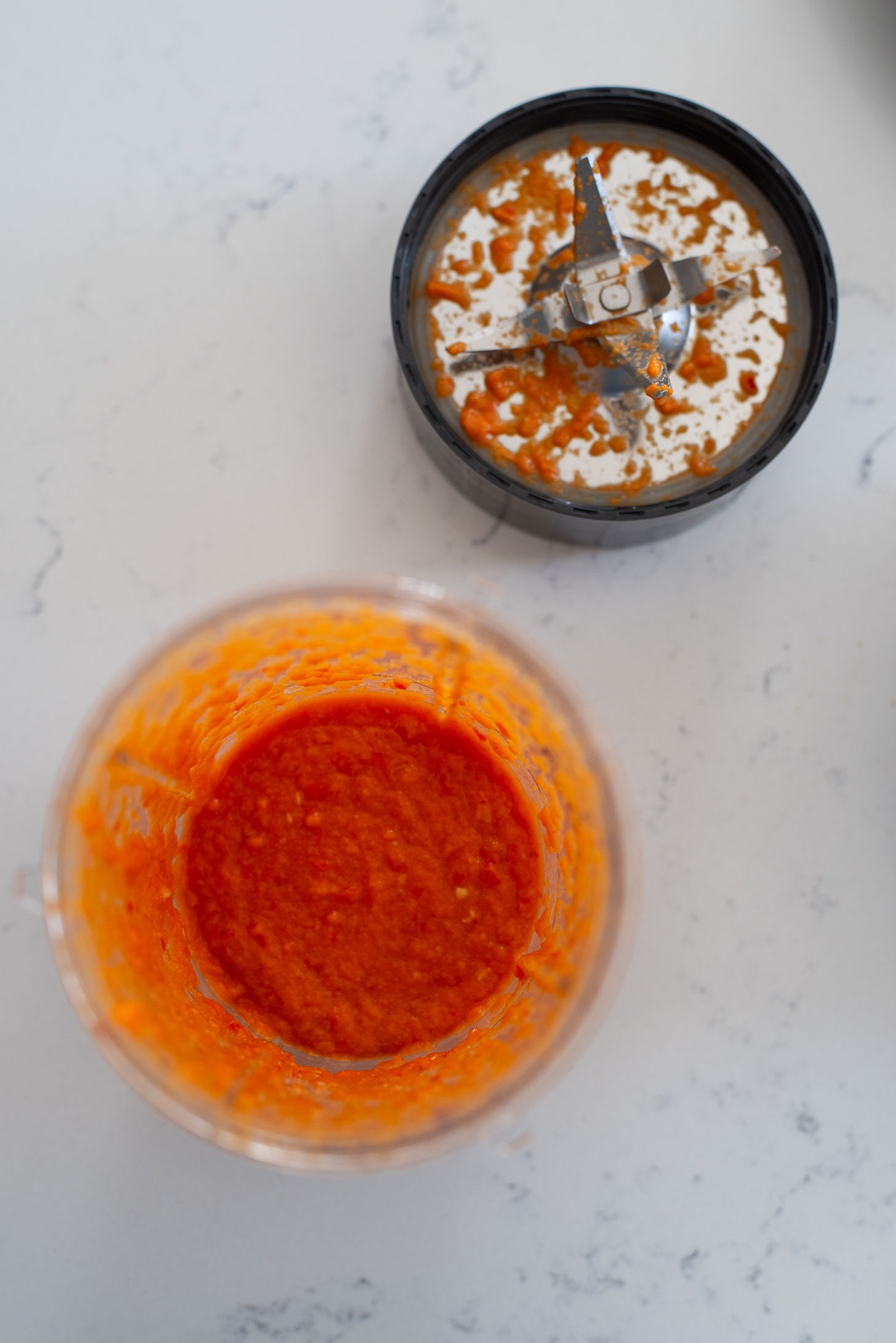 Chili, garlic, belachan, shallot are pureed in a mini food processor to make Nasi Goreng.