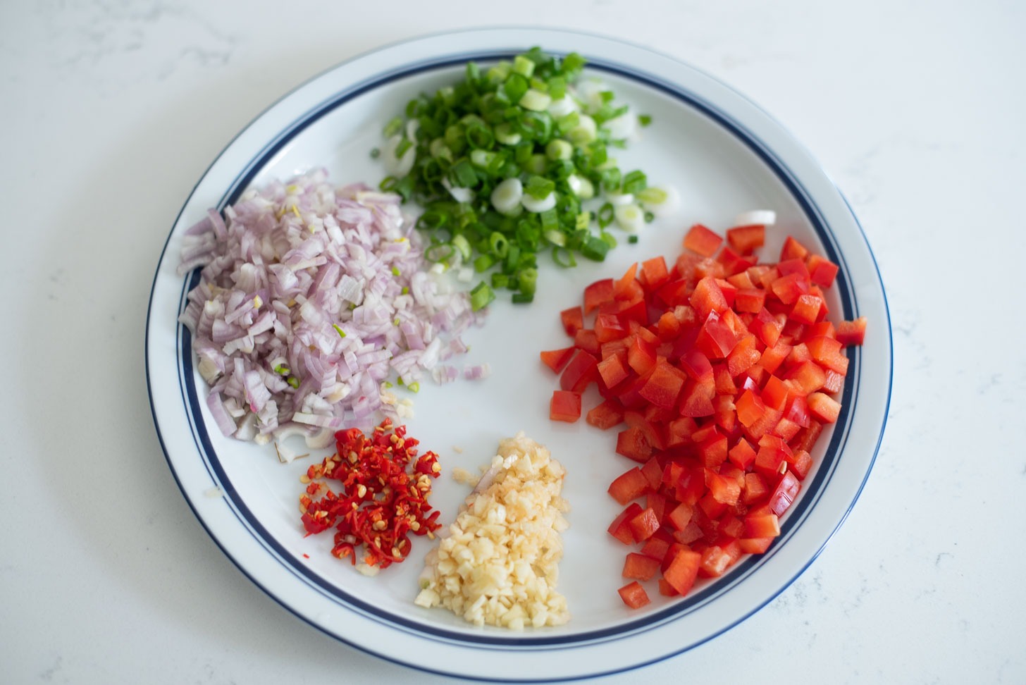 Finely chopped aromatic vegetables for making Pineapple fried rice.