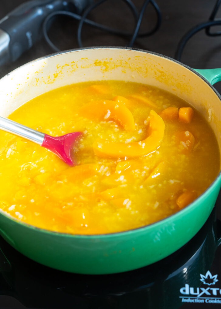 Cooked pumpkin and sweet rice are showing their soft tender texture.