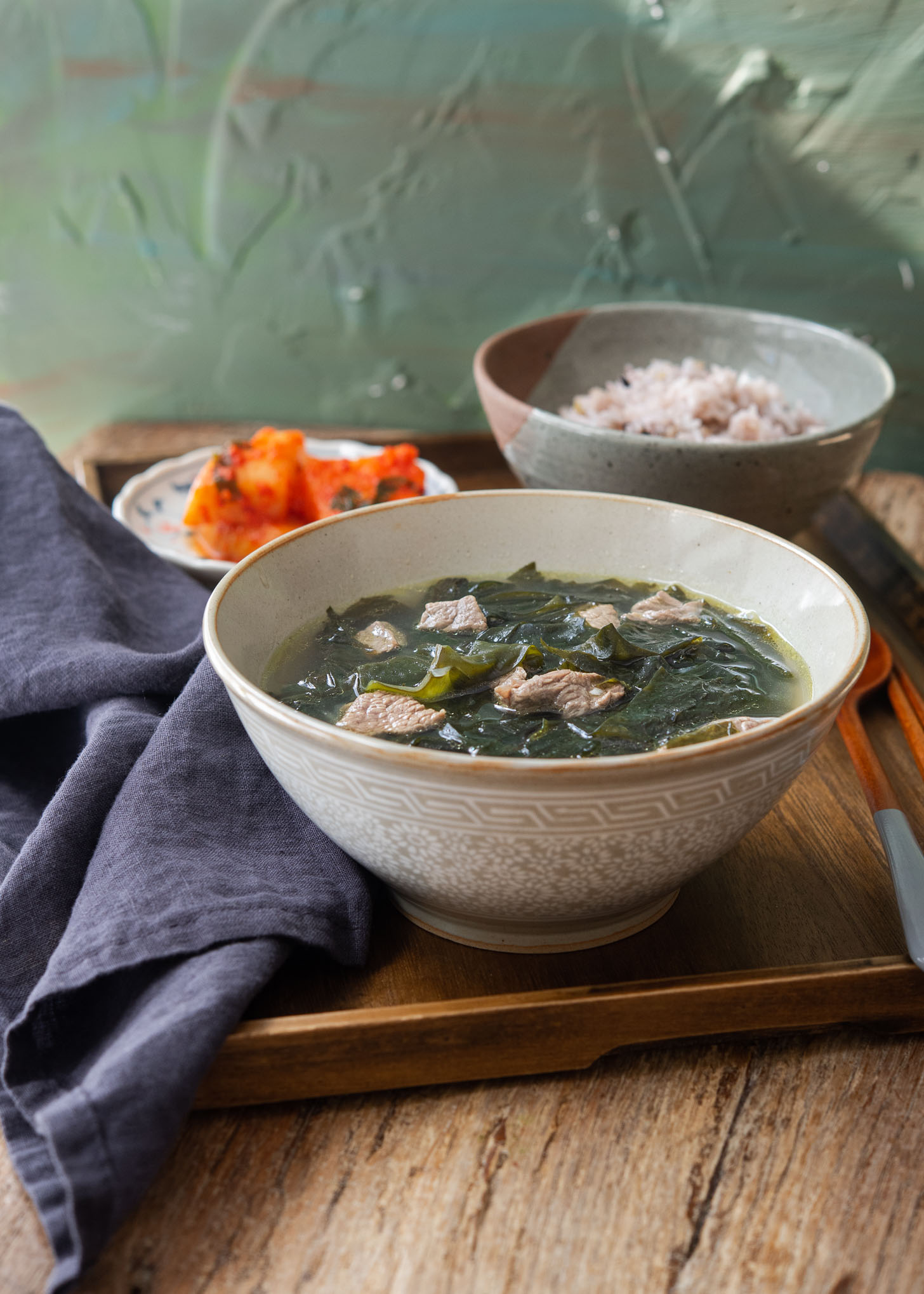 Korean seaweed soup, miyuk guk, served with radish kimchi and rice.