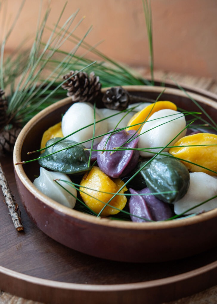 Colorful Korean half-moon shaped rice cakes in a serving plate.