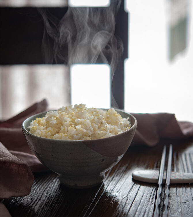 Steaming rice is served in a bowl