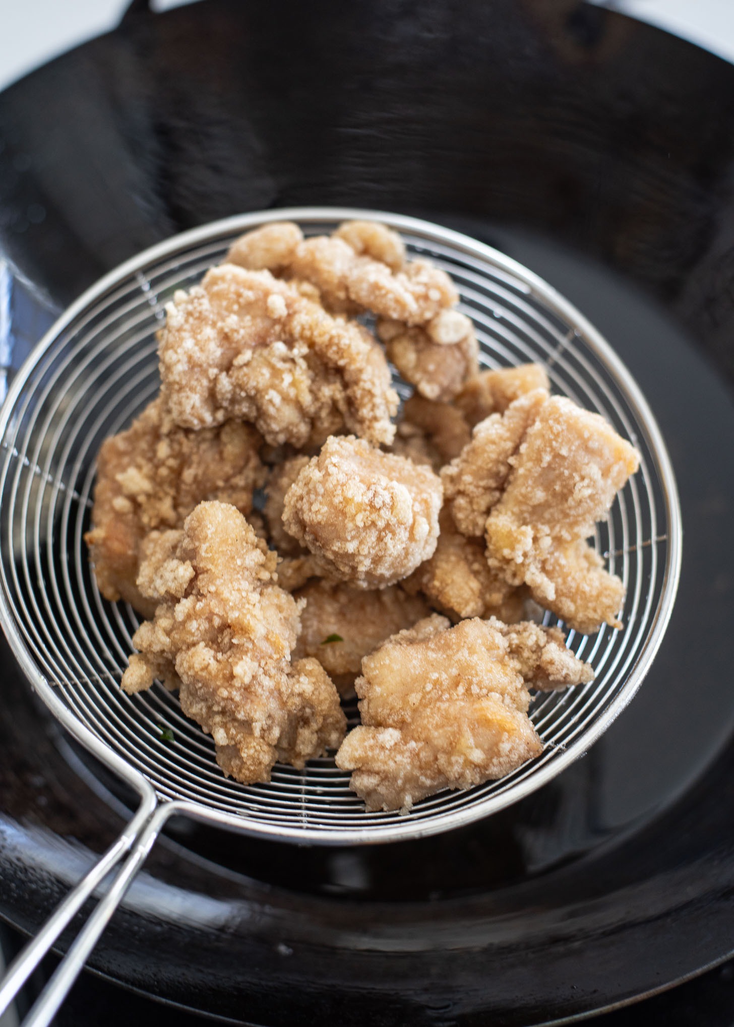 First deep fried chicken pieces are out of frying vegetable oil.