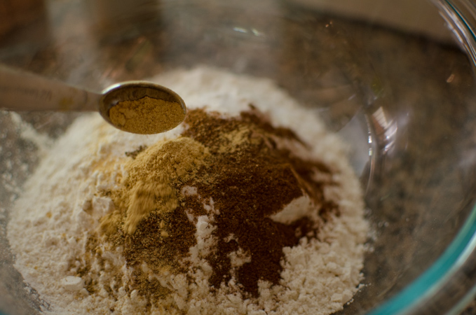 flour and spices are combined in a bowl