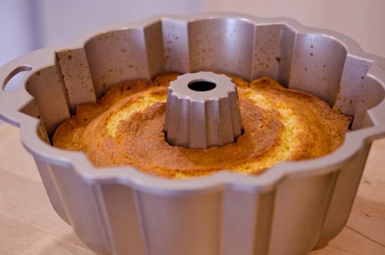 Orange cake is baked to golden brown in a bundt pan.