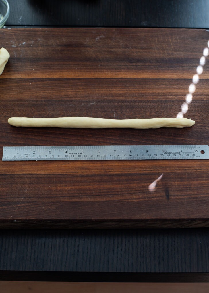 Each dough pieces are stretched into 12-inch rope.