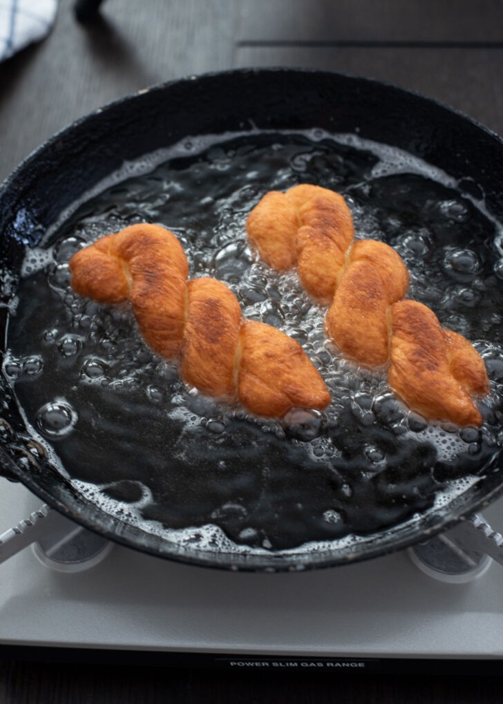 Korean twisted donuts are deep-fried to golden brown and crisp.